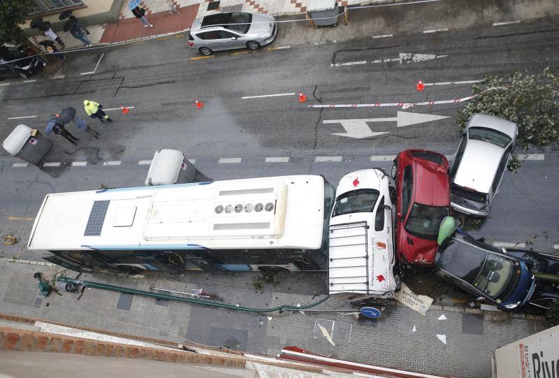 Out-of-control bus ploughs into parked cars as driver suffers heart attack