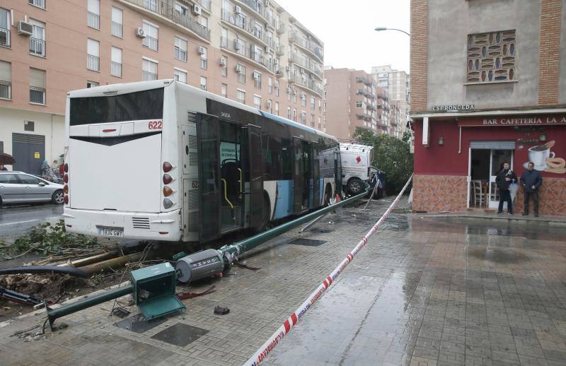 Out-of-control bus ploughs into parked cars as driver suffers heart attack