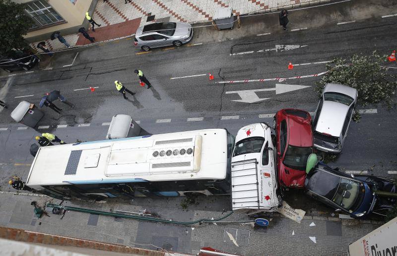 Out-of-control bus ploughs into parked cars as driver suffers heart attack